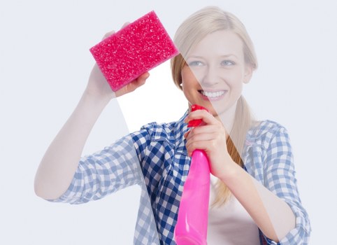 Professional cleaner maintaining a Harringay office meeting room