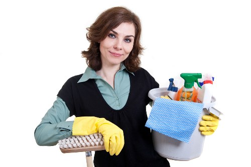 Local sofa cleaner working carefully on upholstery in Harringay